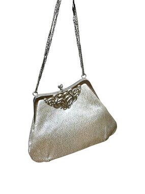 1960s silver lurex evening back with silver chrome decorative accent frame